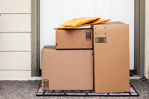 Packages delivered in front of the front door of a home