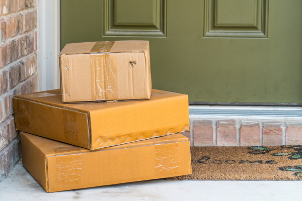 Packages delivered in front of the front door of a home