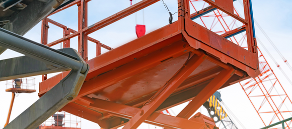 Orange boom lift